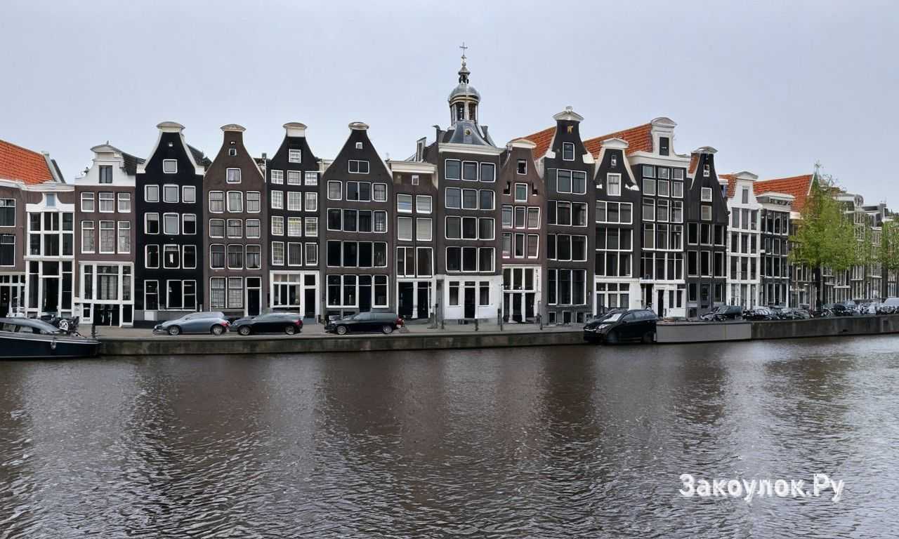 Амстердам Нидерланды каналы мосты и прогулки на лодке по историческому центру